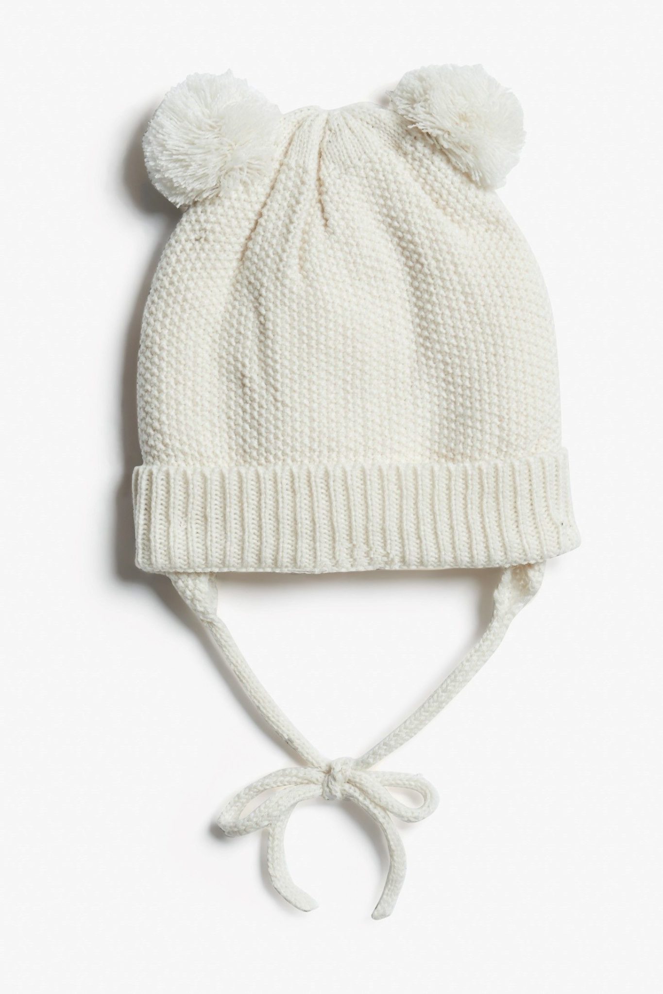 Tuque en tricot à pompons